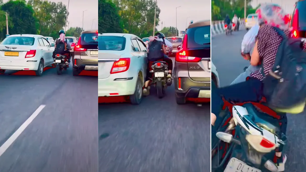 दो गाड़ियों के बीच से बाइक निकालने चला शख्स, स्टंट के चक्कर में सड़क पर गिरा; लापरवाही देख लोग हैरान दो गाड़ियों के बीच से बाइक निकालने चला शख्स, स्टंट के चक्कर में सड़क पर गिरा; लापरवाही देख लोग हैरान